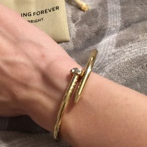 Gold tone nail bracelet